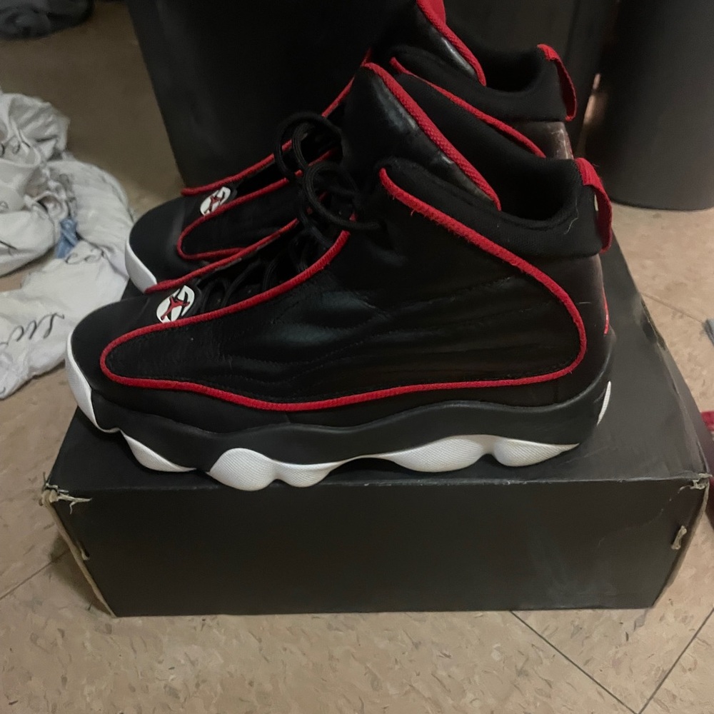 Jordan Pro Strong in the "Black University Red" colorway
